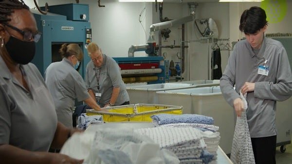 Environmental Services for Senior Living: Sorting and Folding Clean Laundry