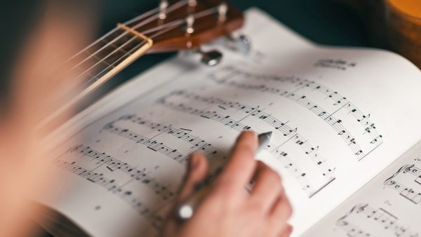 Learning to Play Guitar: Tuning Up, Reading Music, and Dexterity